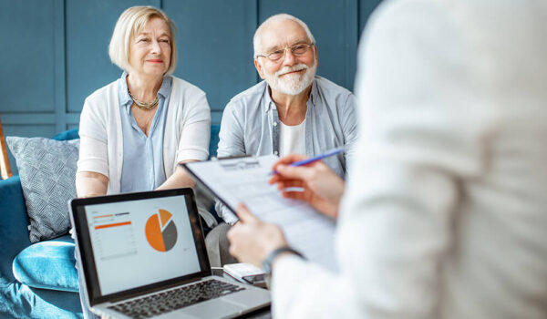 Happy senior couple during the meeting with financial consultant Happy senior couple during the meeting with financial consultant